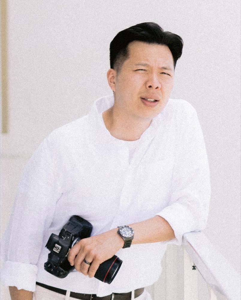 Forster Chan holding his camera