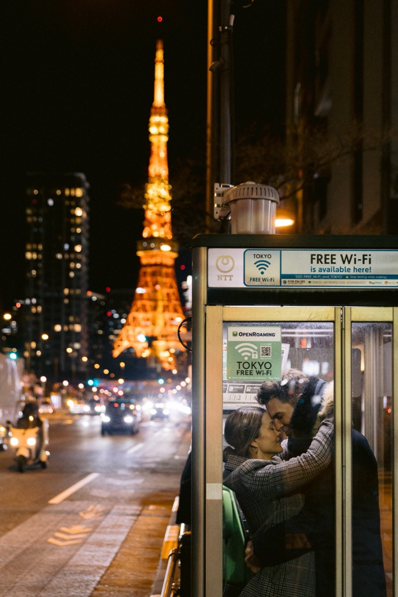 Couple outside a FamilyMart at night